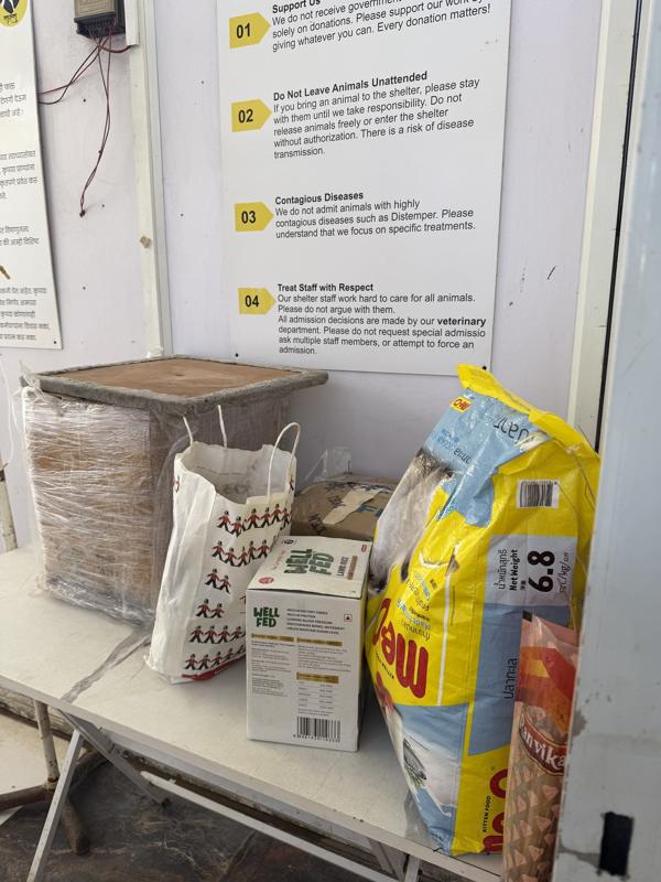 Bags of donated dog and cat food at the shelter